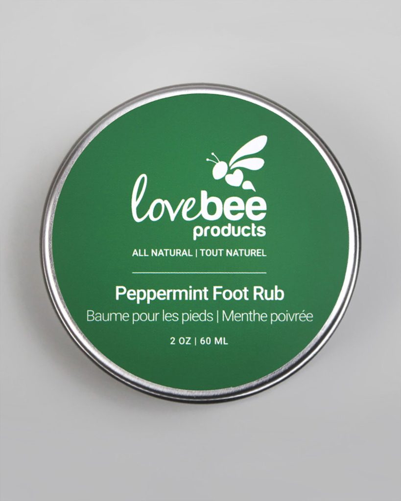 A peppermint foot rub tin with a green label